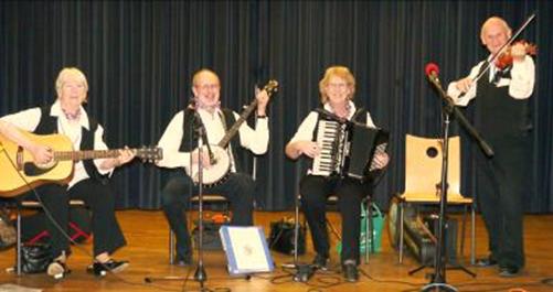 Four piece band on stage at festival in Laval, France, 2013.